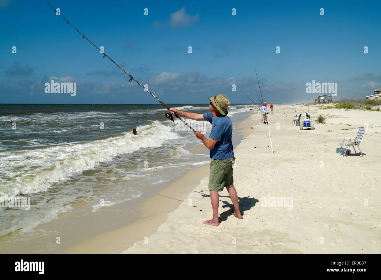 Surf fishing in the Gulf of Mexico near Gulf Shores, Alabama Stock Photo