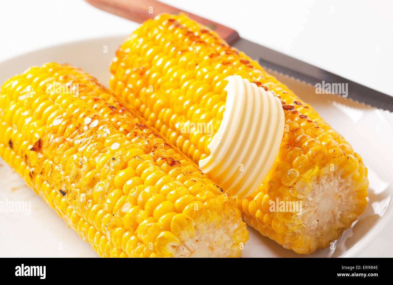 Roasted corn on the cob with butter Stock Photo Alamy