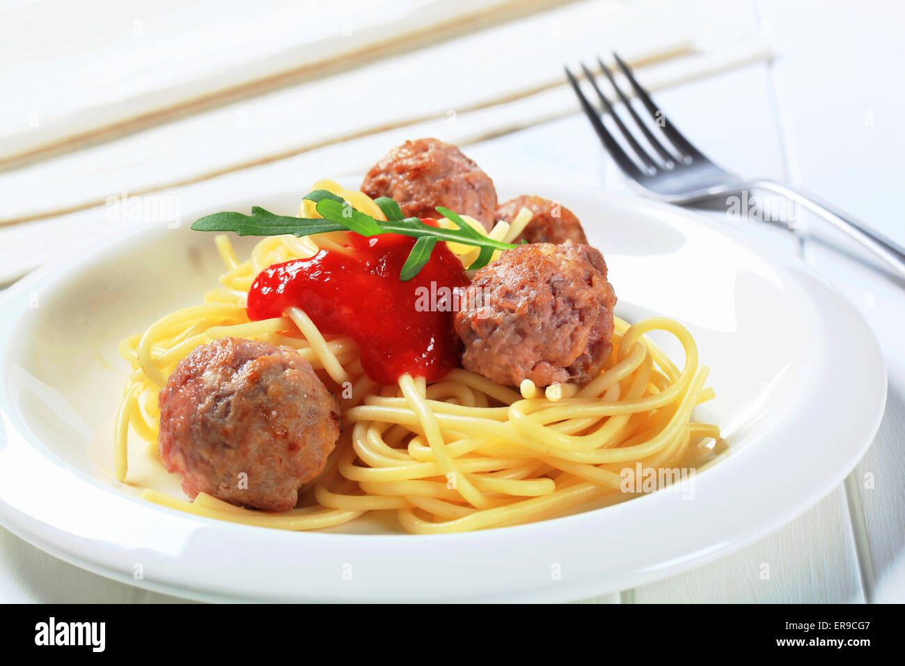 Pan fried meatballs with spaghetti and ketchup Stock Photo Alamy