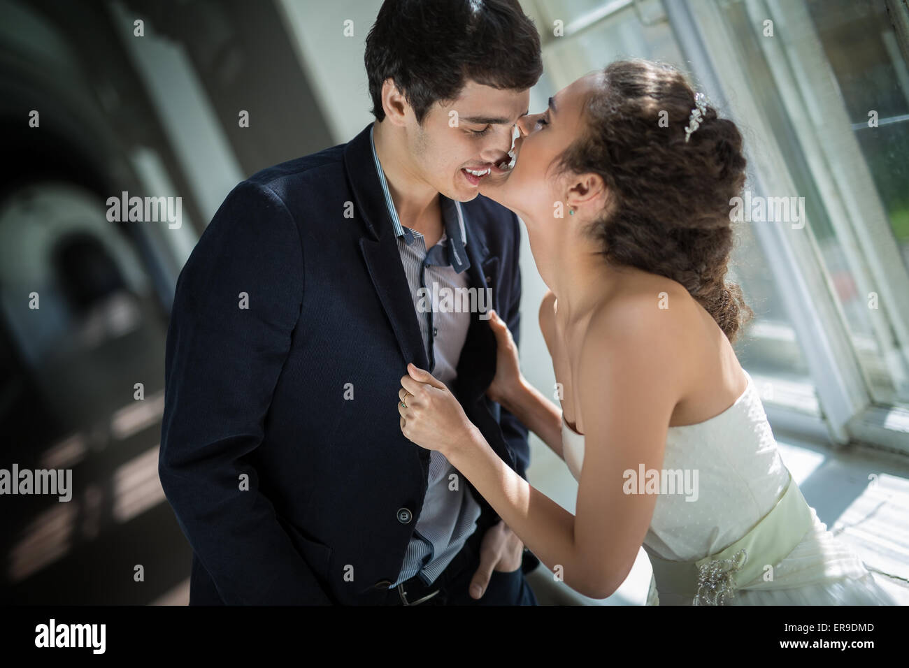 Portrait of happy wedding couple in classic interior Stock Photo - Alamy