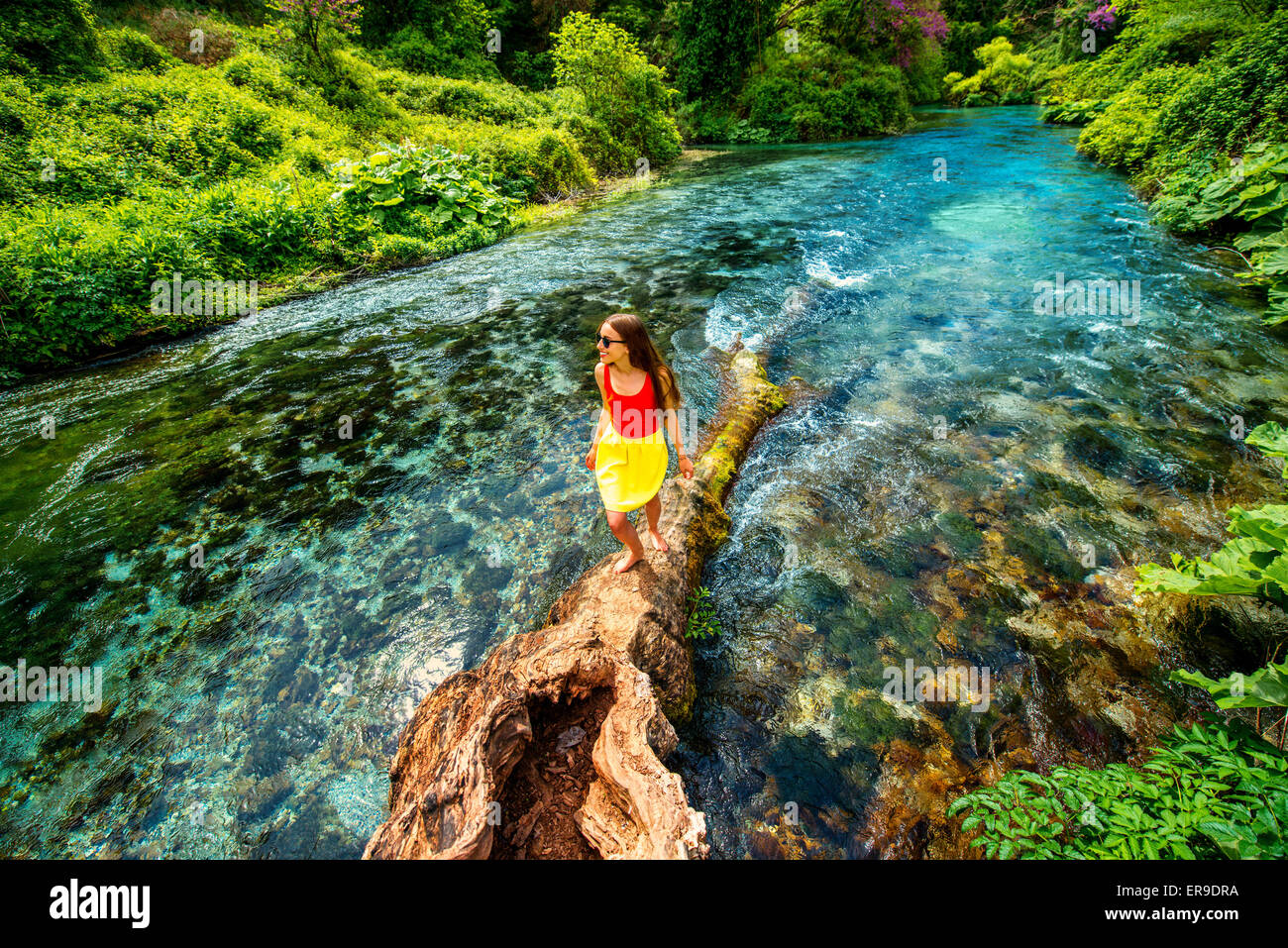 Girl walking on the river Stock Photo - Alamy