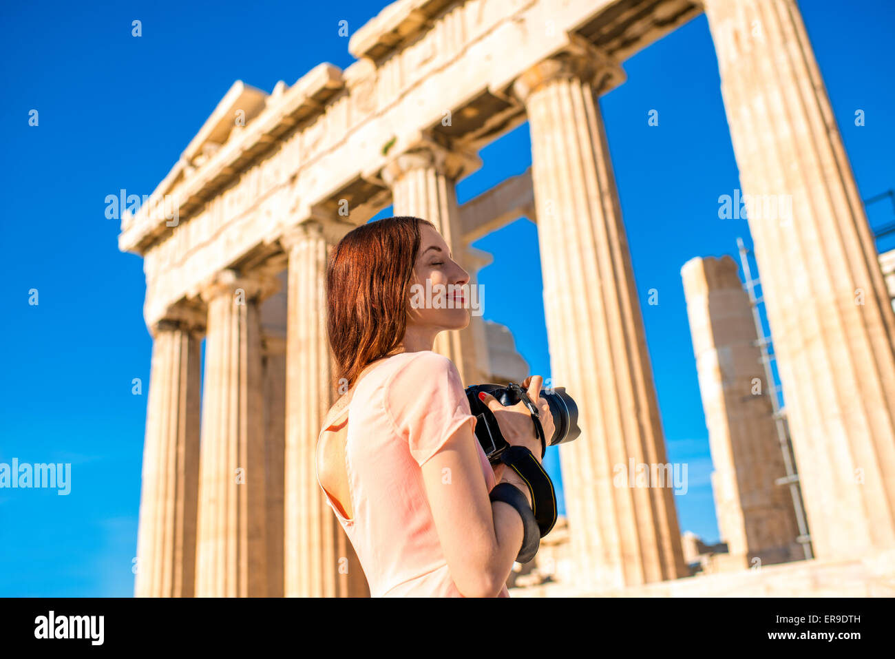 Woman photographing Parthenon temple in Acropolis Stock Photo