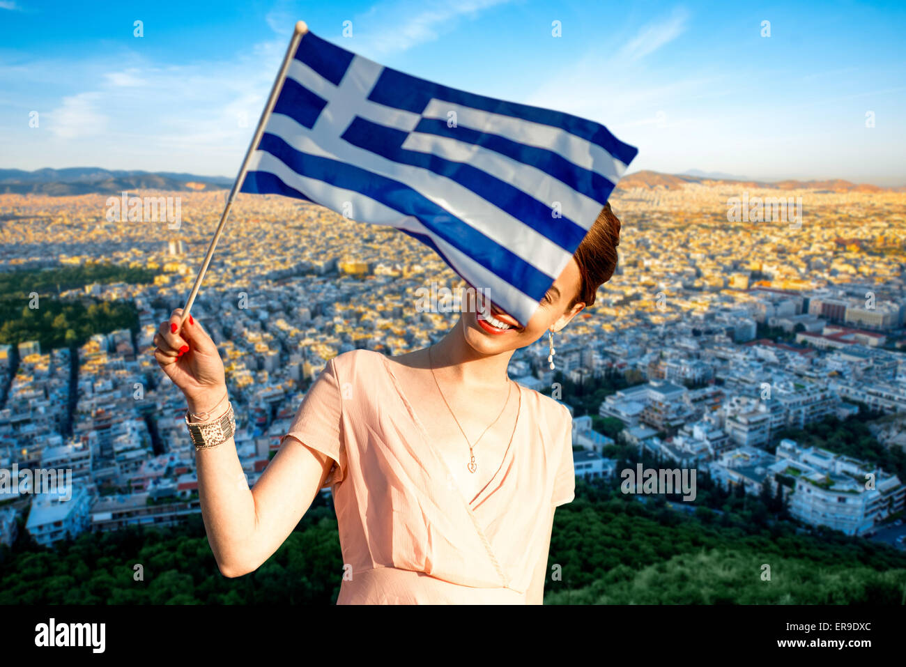 Woman with Greek flag on Athens cityscape background Stock Photo