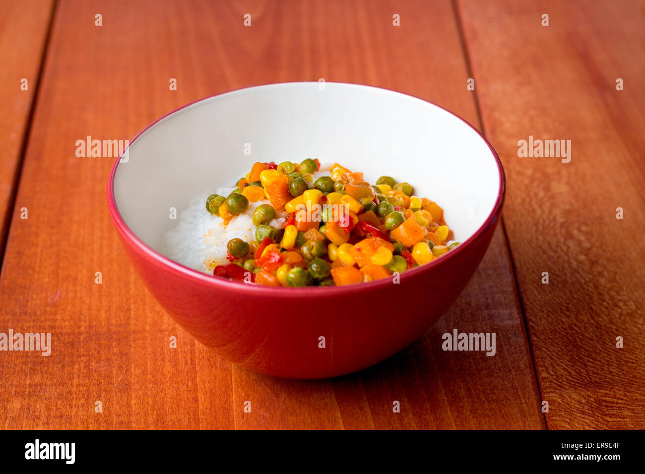 Bowl of Asian sticky rice with vegetable sauce Stock Photo