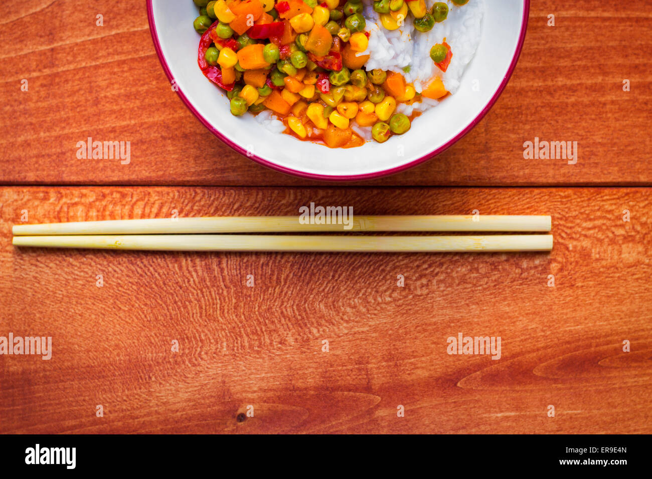 Bowl of Asian sticky rice with vegetable sauce Stock Photo