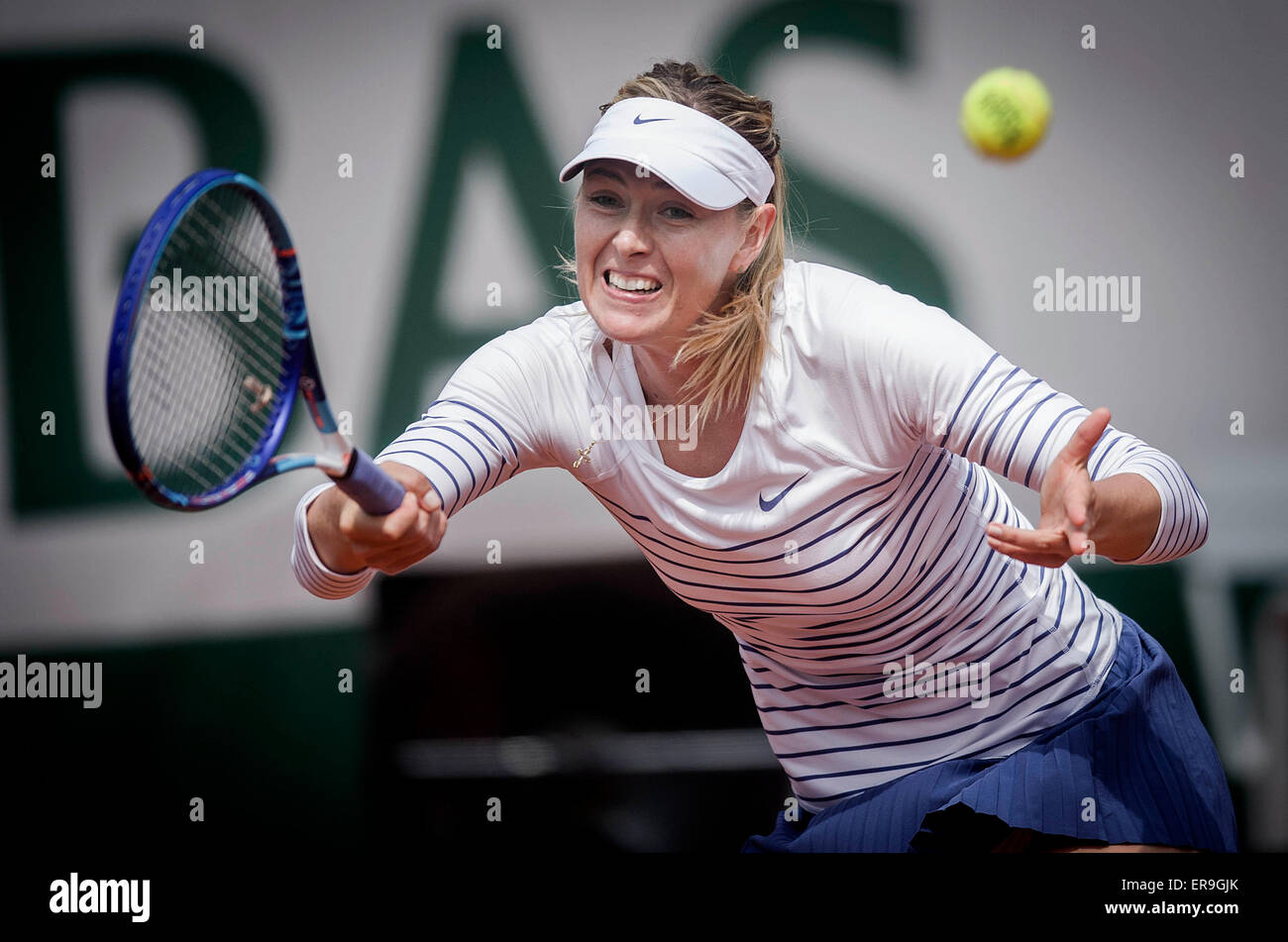 Paris, France. 29th May, 2015. Maria Sharapova of Russia hits a return during the women's singles 3rd round match against Samantha Stosur of Australia at the 2015 French Open tennis tournament in Paris, France, on May 29, 2015. Maria Sharapova won 2-0. Credit:  Chen Xiaowei/Xinhua/Alamy Live News Stock Photo