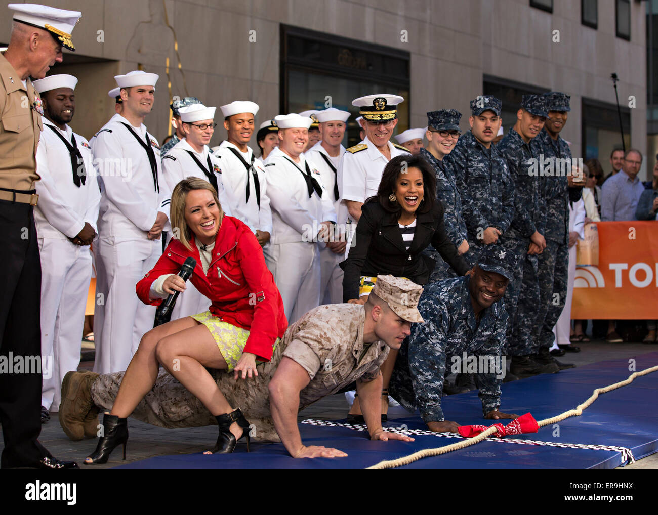 US Marines and sailors display their strength by performing push ups with NBC Today show hosts on their backs during the morning talk show as a part of Fleet Week May 23, 2015 in New York City, NY.  Marines showcase the capabilities of the Marine Corps both physically, mentally and technologically during Fleet Week New York. Stock Photo