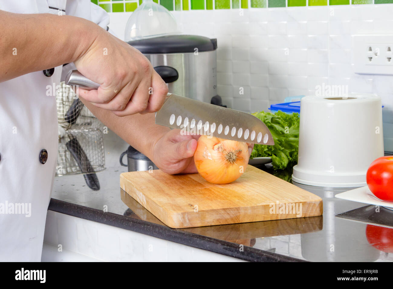 Chef chopping onion on the cutting board Stock Photo - Alamy