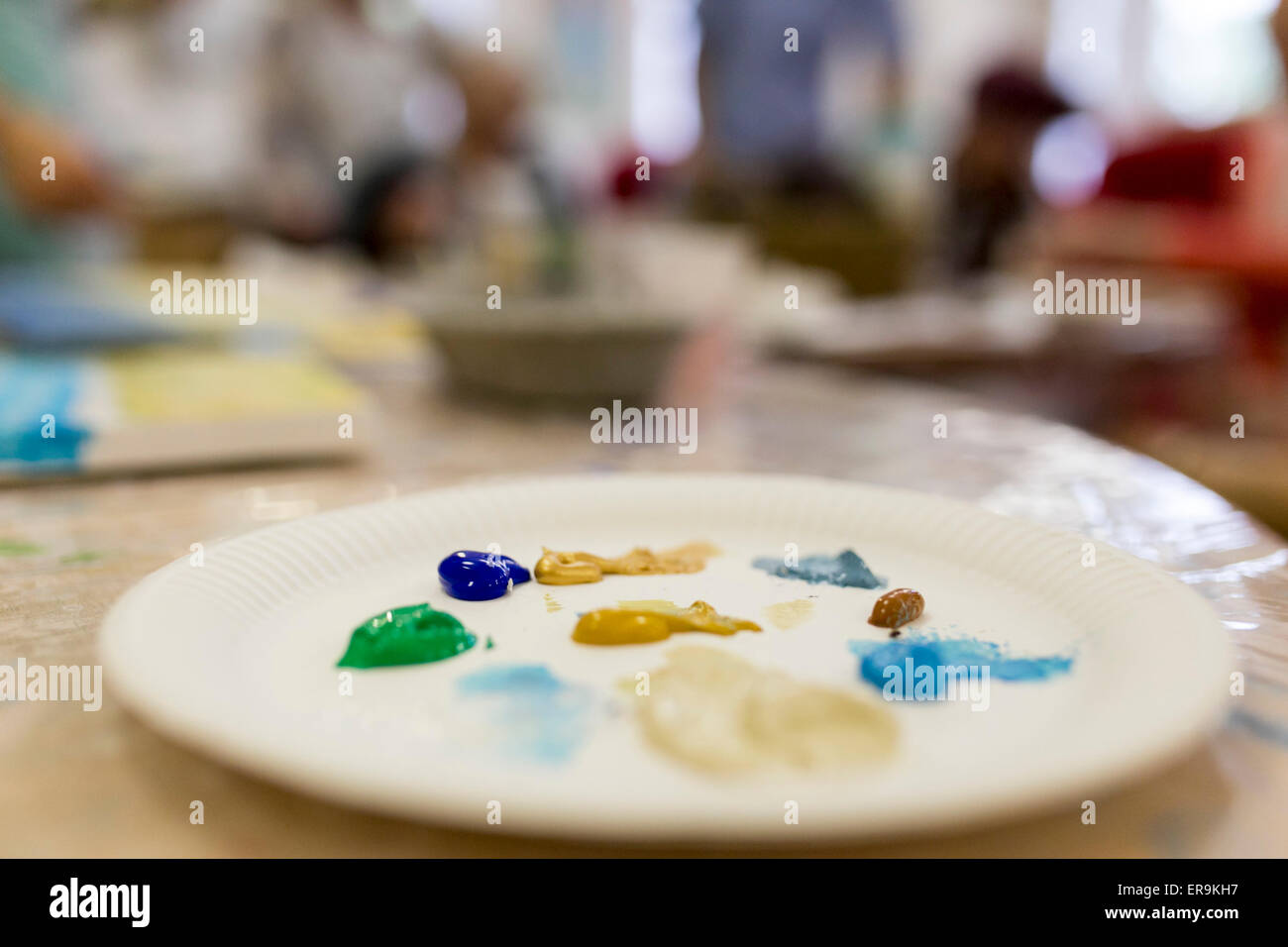 a paper plate being used as a paint palette Stock Photo Alamy