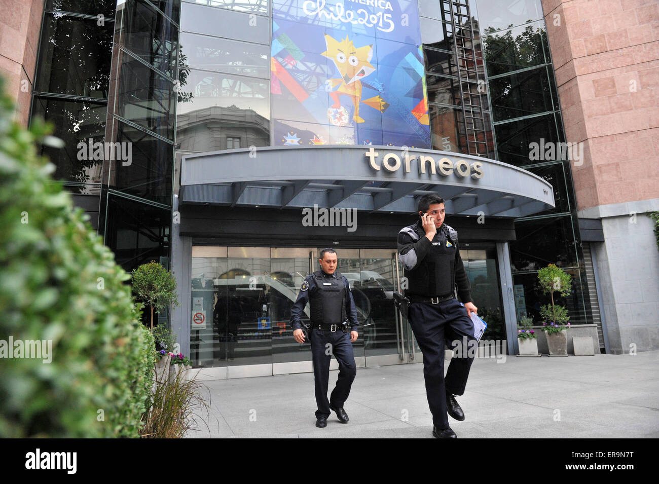 (150530) -- BUENOS AIRES, May 30, 2015 (Xinhua) -- Personnel of the Interpol Department of the Federal Argentine Police are seen at the headquarters of Argentine sports broadcaster Torneos y Competencias during a raid, in Buenos Aires, capital of Argentina, on May 29, 2015. The Argentina Justice Department issued on Thursday the national arrest warrant for three businessmen involved in the corruption scandal of FIFA (International Federation of Association Football). Alejandro Burzaco, CEO of Torneos y Competencias, and brothers Hugo and Mariano Jinkis, owners of a sports marketing company lin Stock Photo