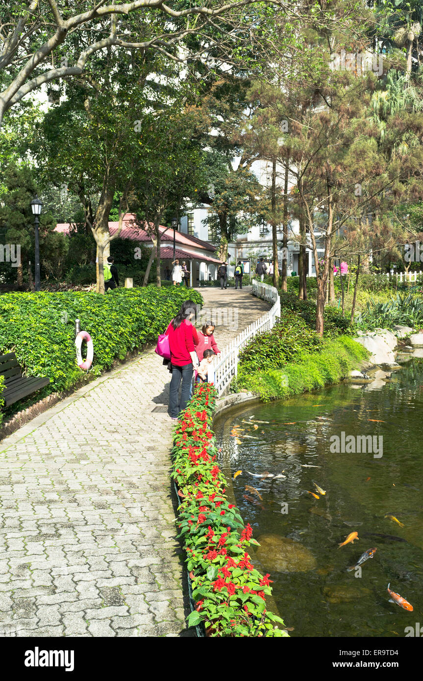 dh Hong Kong Park CENTRAL HONG KONG Chinese mother and children by fish pond in Hong Kong park people ponds china family outdoors garden Stock Photo