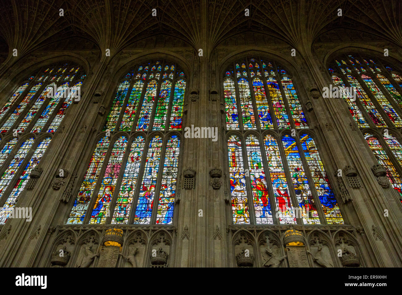 UK, England, Cambridge. King's College Chapel, Stained Glass Windows above Symbols of Royal