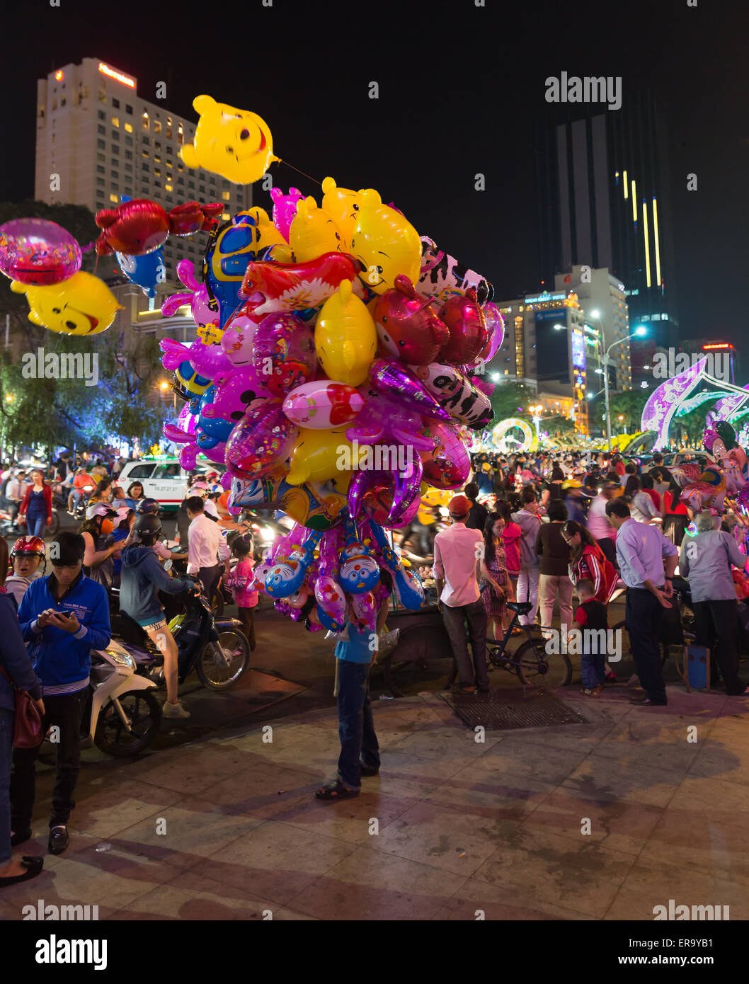SAIGON, VIETNAM - FEBRUARY 02, 2014: Vibrant night scene at Lunar New Year in center of Saigon Stock Photo