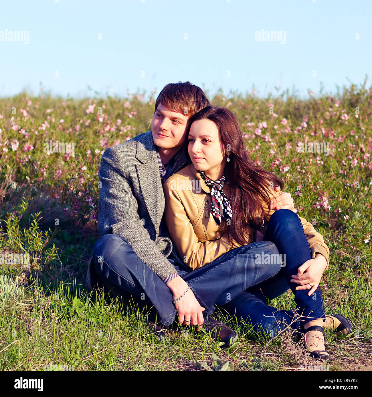 Outdoor Portrait of young couple against the sky Stock Photo