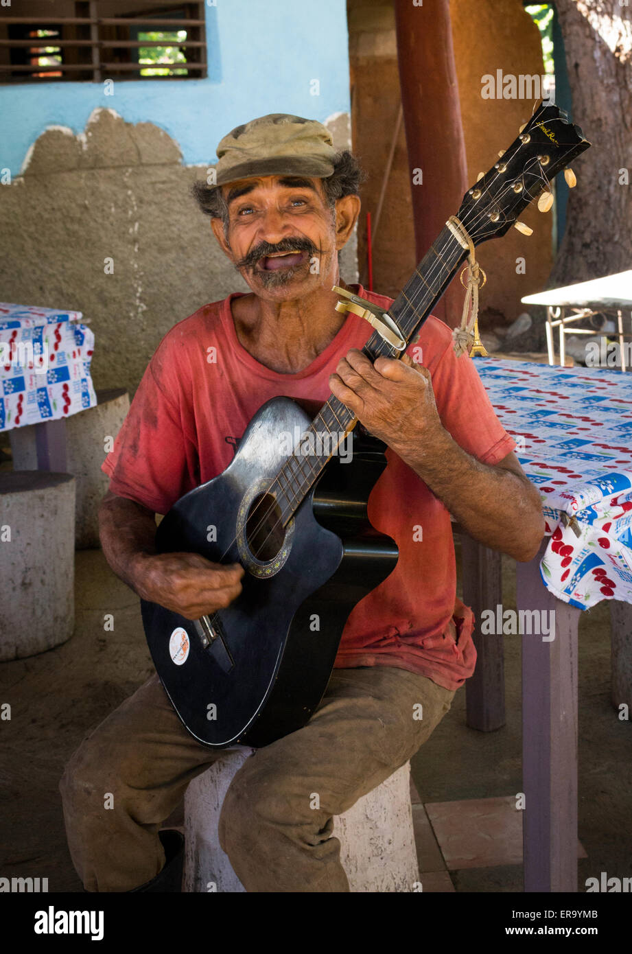 Portrait of elderly man with guitar singing in Trinidad Cuba Stock Photo