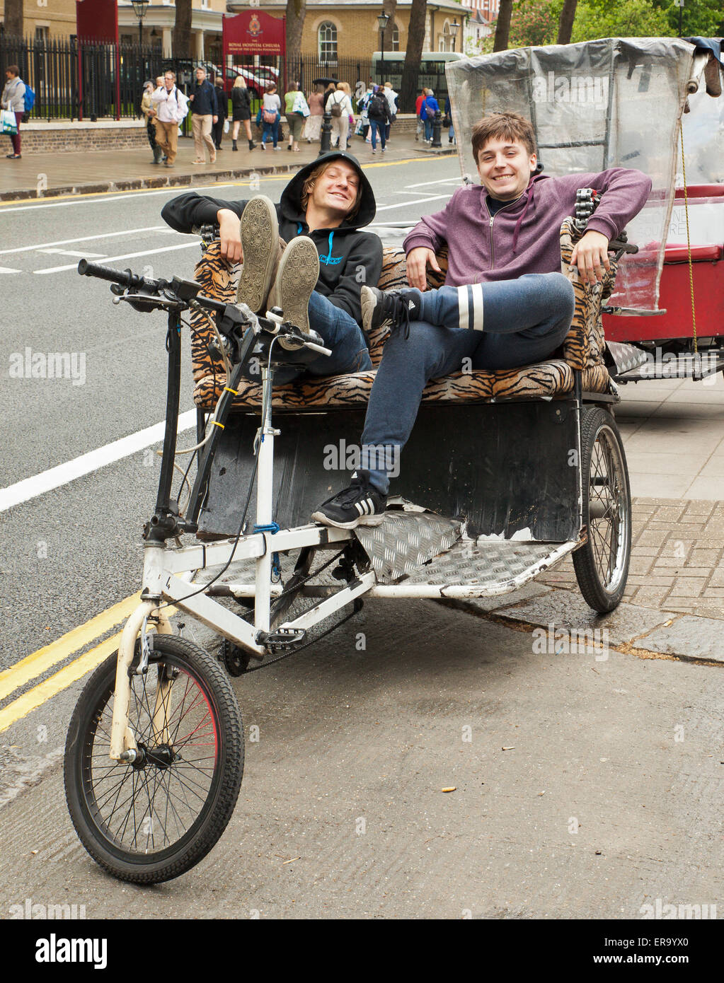 Couple of rickshaw riders having a break. Stock Photo