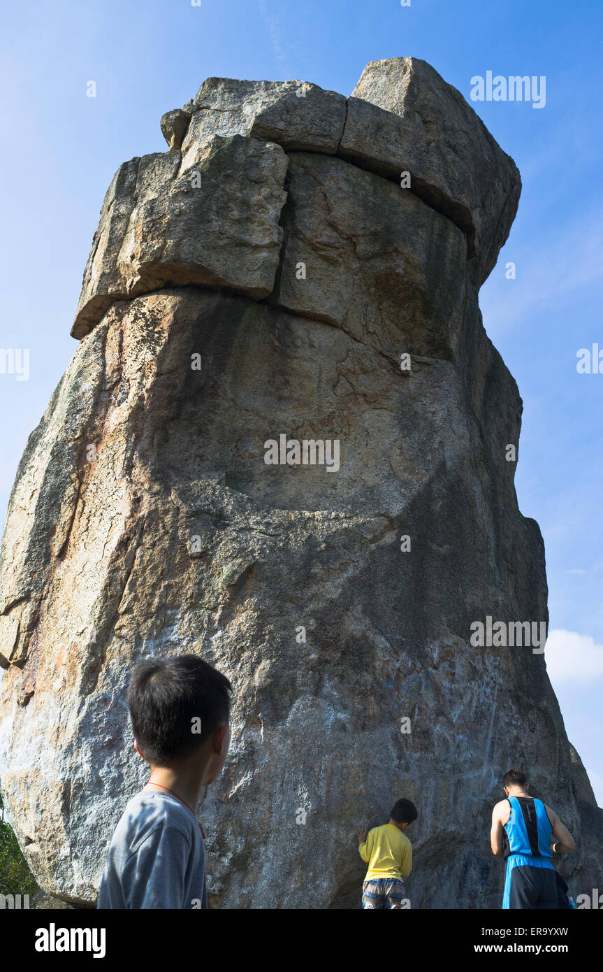 dh Amah Rock NEW TERRITORIES HONG KONG Chinese boy looking up at Amah Rock Lion Rock Country Park Stock Photo