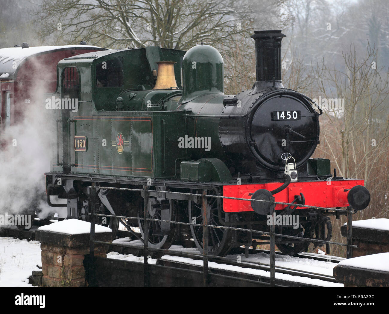 One of Britain's smaller locomotives, No.1450 0-4-2 Tank engine waits just outside of a snowy Highley Stock Photo