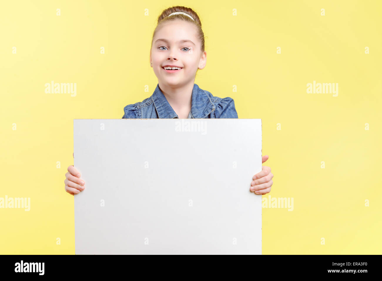 Small girl holding a copy space Stock Photo - Alamy
