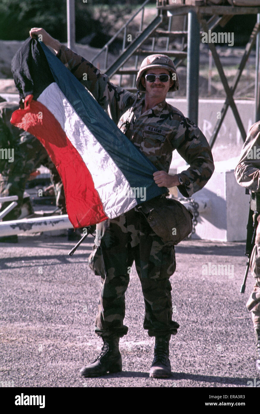 7th March 1991 A U.S. Army soldier proudly displays the Kuwaiti flag