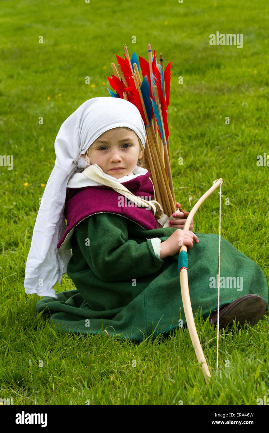 Young child archer 4 years old, at the War of the Roses re-enactment by Sir John Saviles Household and 15th century group. Hoghton Tower Preston transformed with living history displays from the era of Elizabeth Woodville (the White Queen) and Richard III. known as The Cousins War or War of the Roses was  the dynastic struggle between the royal households of York and Lancaster which each claimed their right to rule from their links to the usurped Edward III. Stock Photo