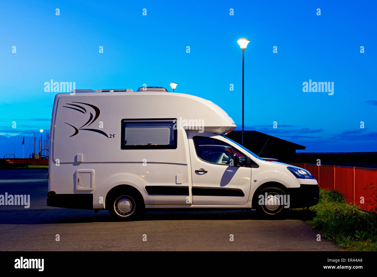 Romahome 25, small motorhome, in car park at night Stock Photo