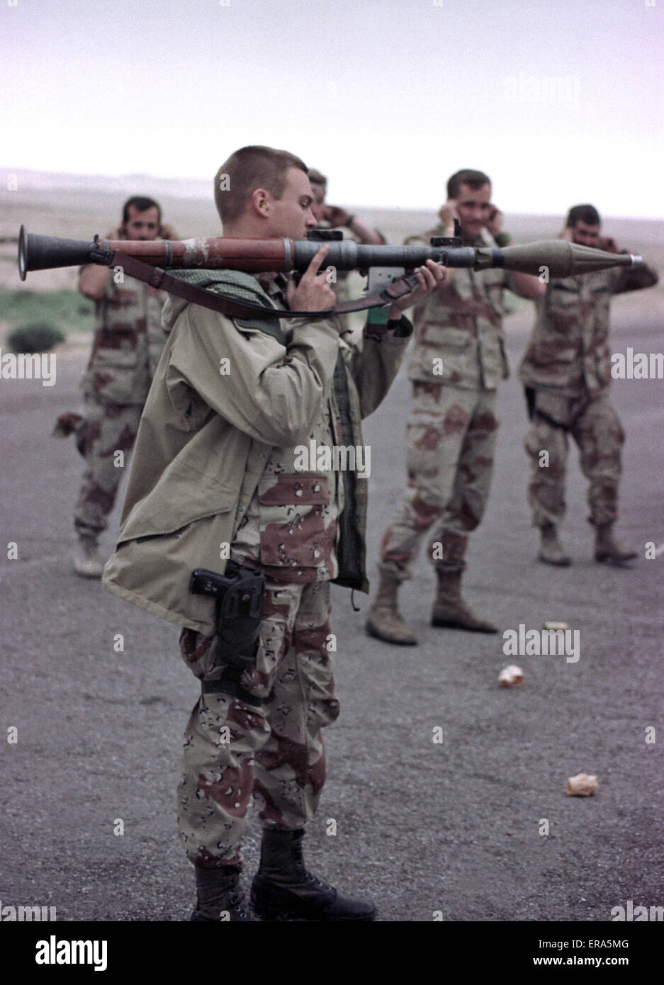 23rd March 1991 U.S. Army soldiers have fun with an abandoned Iraqi RPG in the desert in north-east Kuwait. Stock Photo