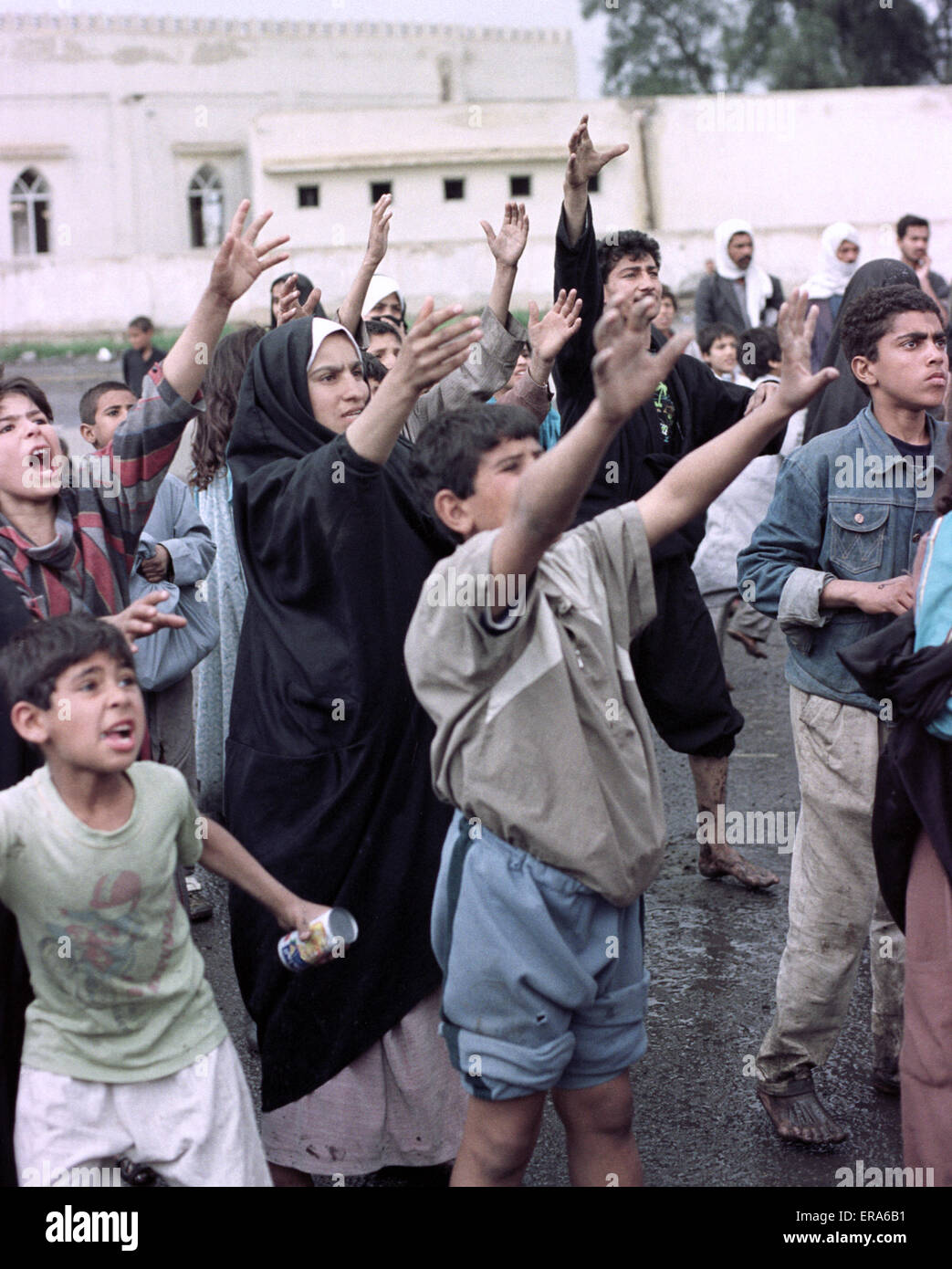 23rd March 1991 Desperate Shia Iraqis reach out for food and drink at a camp near Safwan in southern Iraq, close to the border with Kuwait. Stock Photo