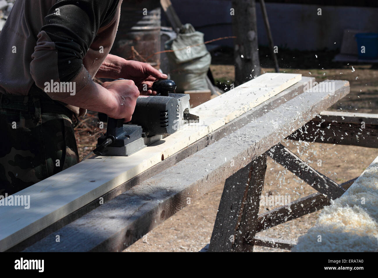 Electric hand plane during processing of boards Stock Photo Alamy