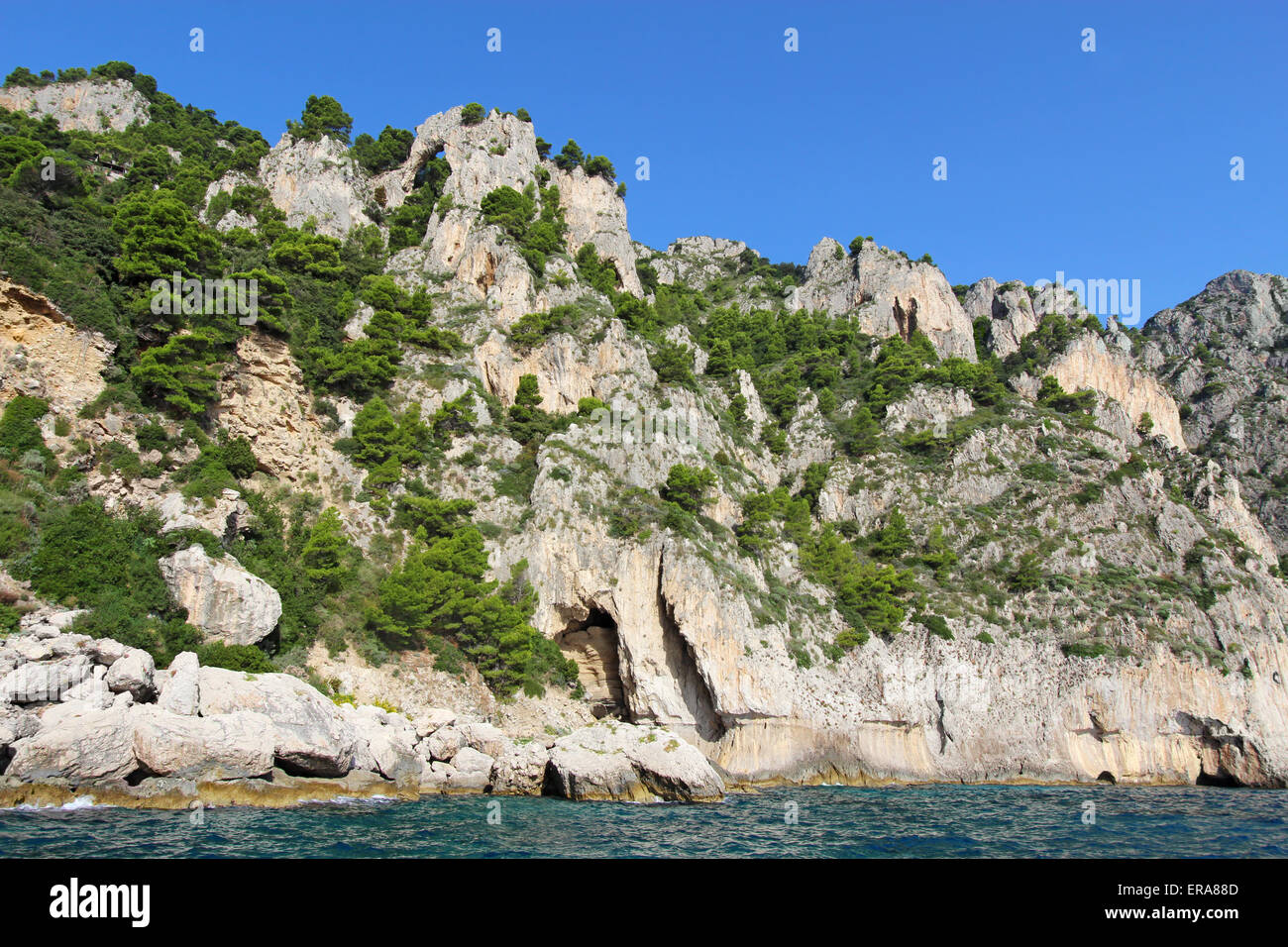 An arch and caves on the coast of Capri island, Italy Stock Photo - Alamy