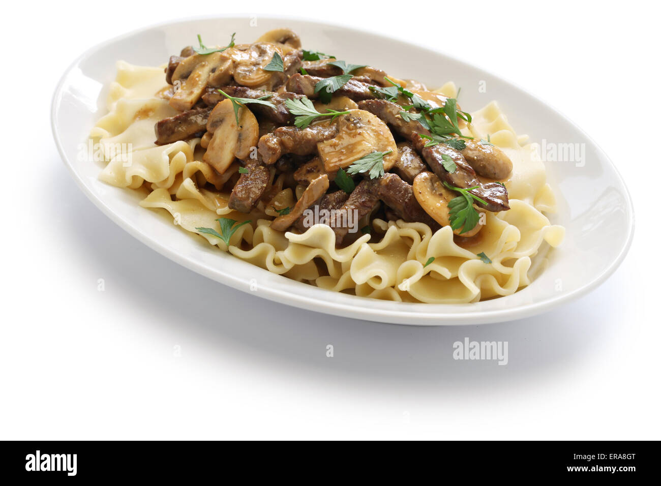 beef stroganoff with pasta, russian cuisine isolated on white background Stock Photo