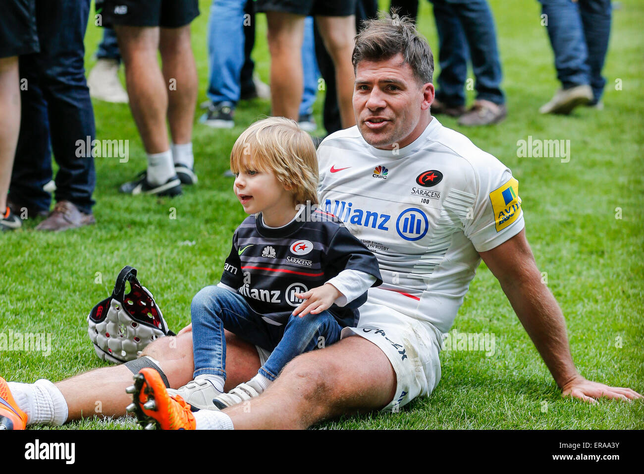 Twickenham, UK. 30th May, 2015. Aviva Premiership Final. Bath versus Saracens. Schalk Brits of Saracens savours the moment of victory with his son. Final score: Bath Rugby 16-28 Saracens. Credit:  Action Plus Sports/Alamy Live News Stock Photo
