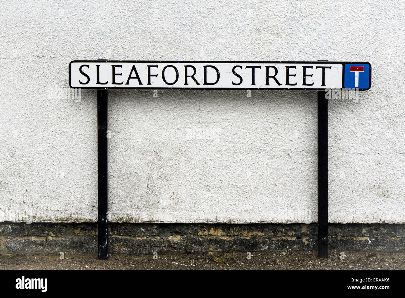 'Sleaford Street' British road sign against weathered wall Stock Photo