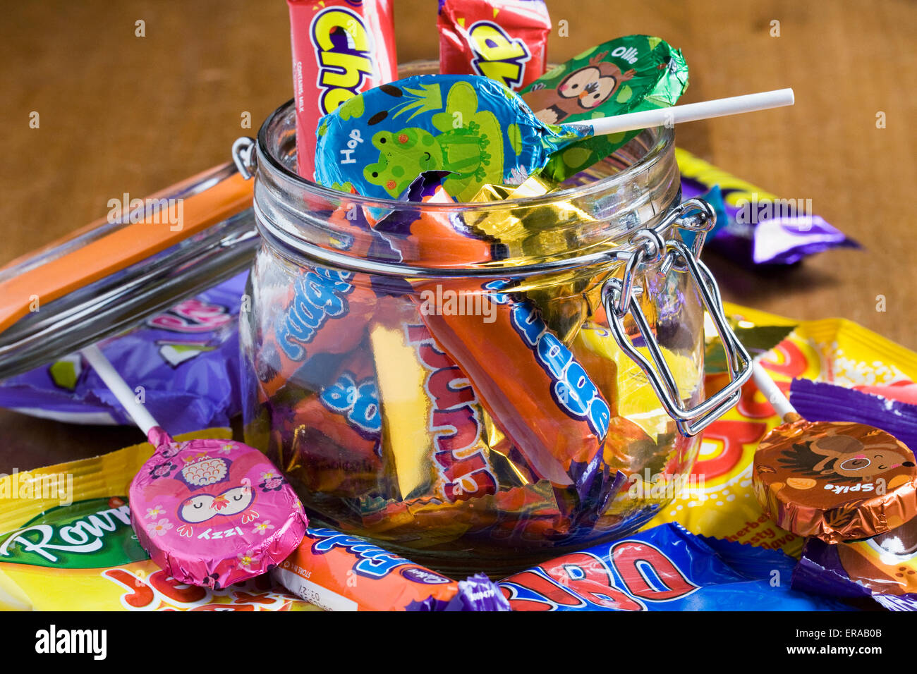 Children's candy in a glass jar. Stock Photo