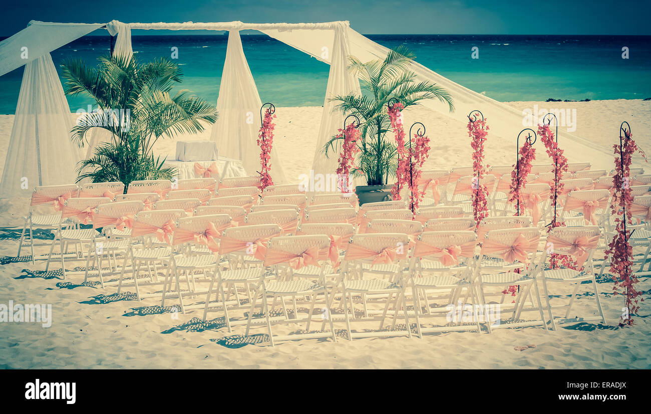 Vintage style photo of wedding altar on the beach Stock Photo