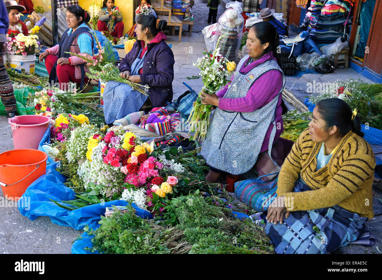 Flower vendors at Sunday market, Urcos (near Cuzco), Peru Stock Photo