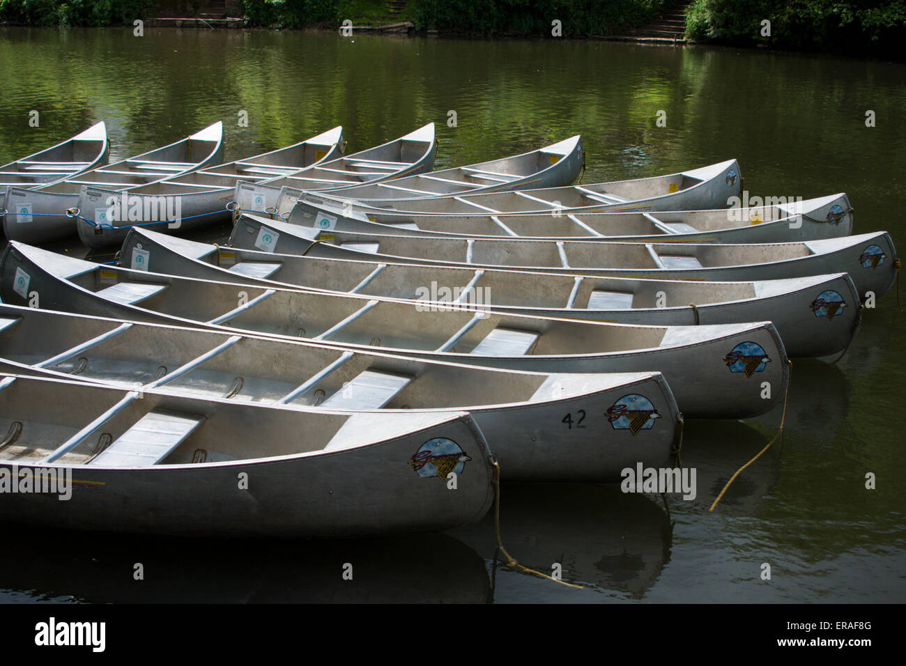 A circle of Grumman aluminium canoes strung together at 