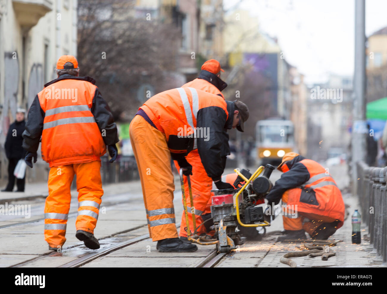 Sofia, Bulgaria - April 7, 2015: Tram road workers are repairing the tram tracks on the tram road. Stock Photo