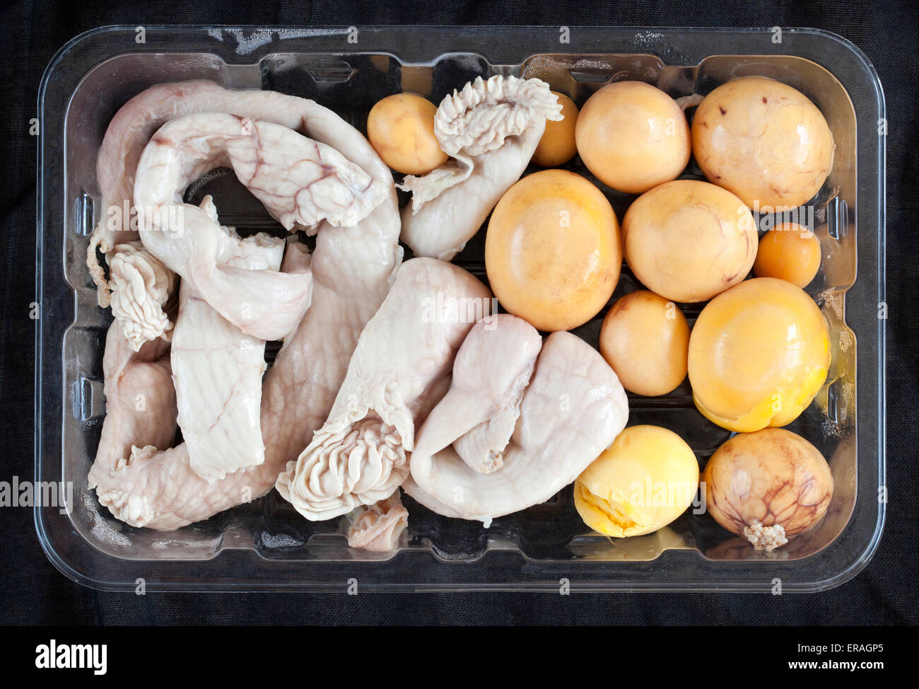 Chinese Hen Egg and Uterus pack of cooking ingredients on sale at supermarket in Thailand Stock Photo