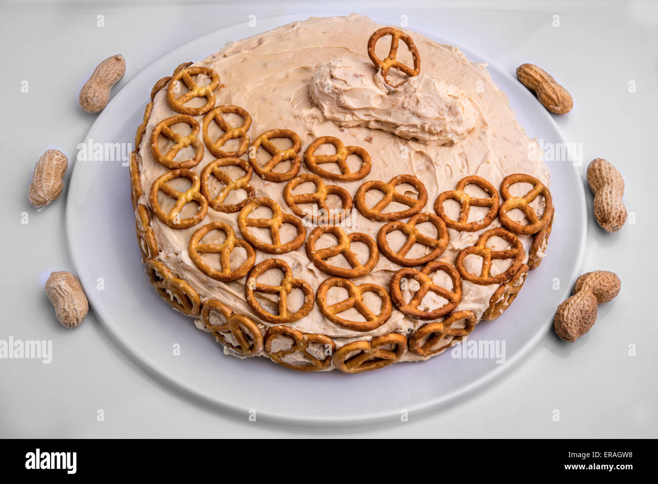 The sweet and salty chocolate cake with peanut butter icing and decorated with pretzels for added crunch. Stock Photo