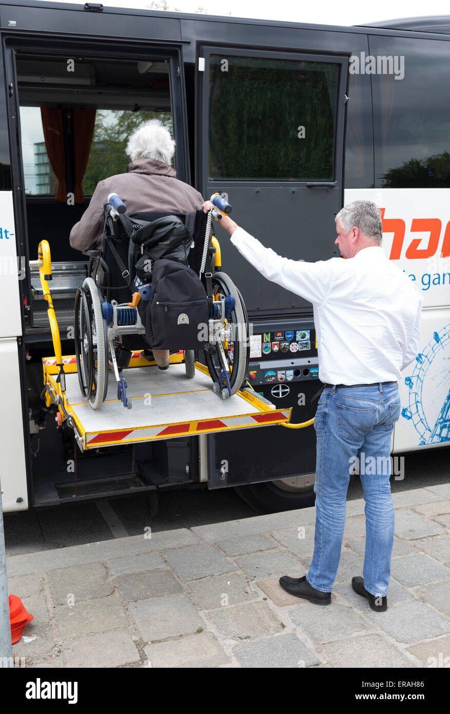 Vienna, Austria May 1, 2015 A bus driver helps physically disabled
