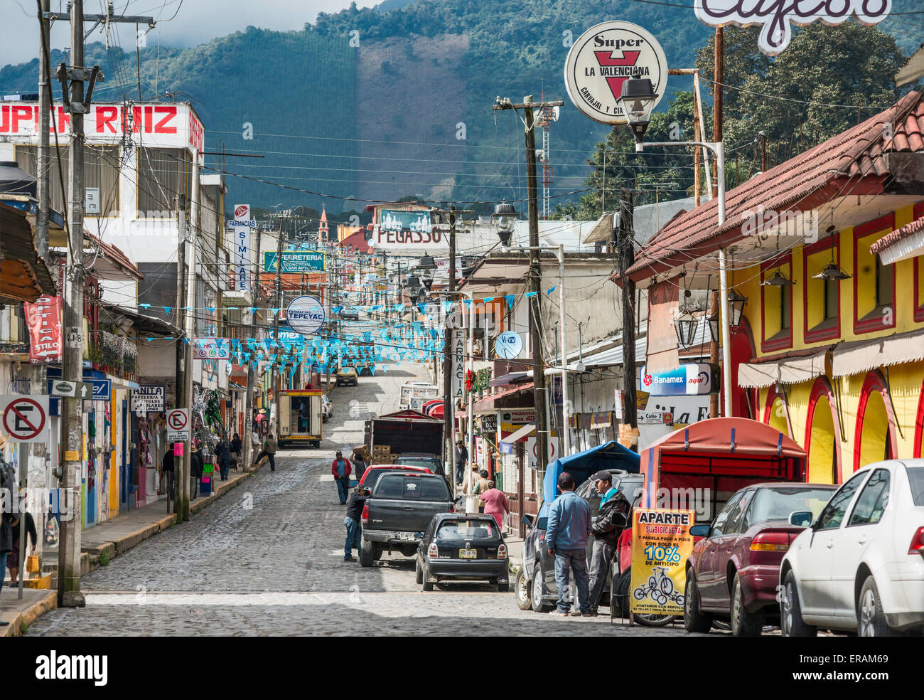 Avenida Nicholas Bravo, cobbled street with utility cables overhead,  decorated with pennants, in Coscomatepec, Veracruz, Mexico Stock Photo -  Alamy