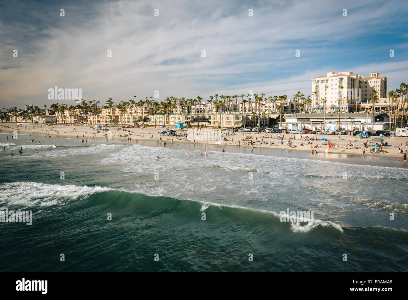 Waves in the Pacific Ocean and view of the beach from the pier in Oceanside, California. Stock Photo