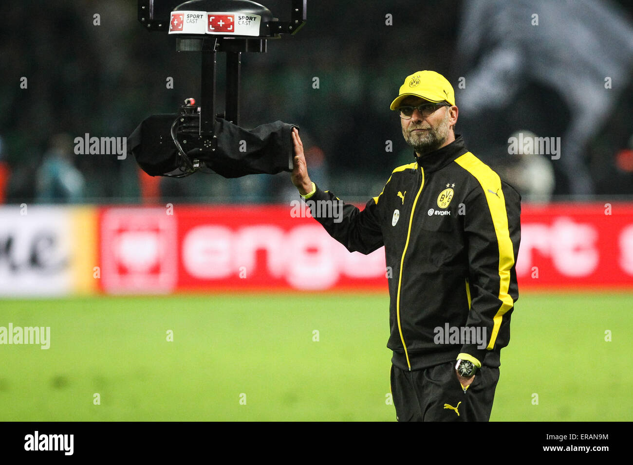 Berlin, Germany. 30th May, 2015. Borussia Dortmund coach Juergen Klopp looks on as he covers the camera after the German Cup (DFB Pokal) final soccer match against VfL Wolfsburg in Berlin, Germany, on May 30, 2015. Borussia Dortmund lost 1-3. © Zhang Fan/Xinhua/Alamy Live News Stock Photo