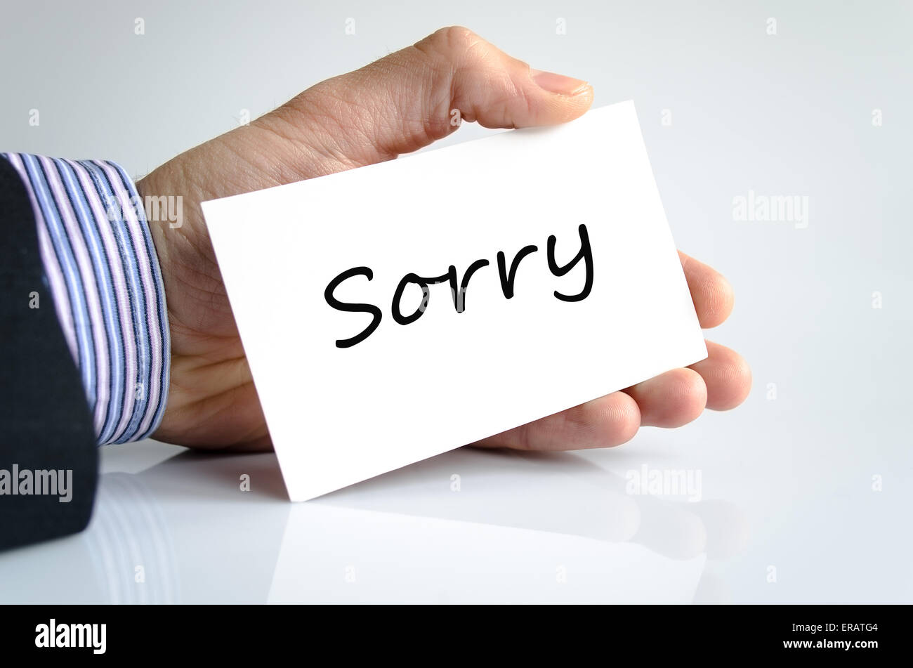 Sorry note in business man hand Stock Photo