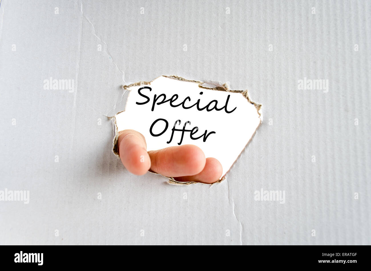 Hand and text on the cardboard background  Special offer Concept Stock Photo