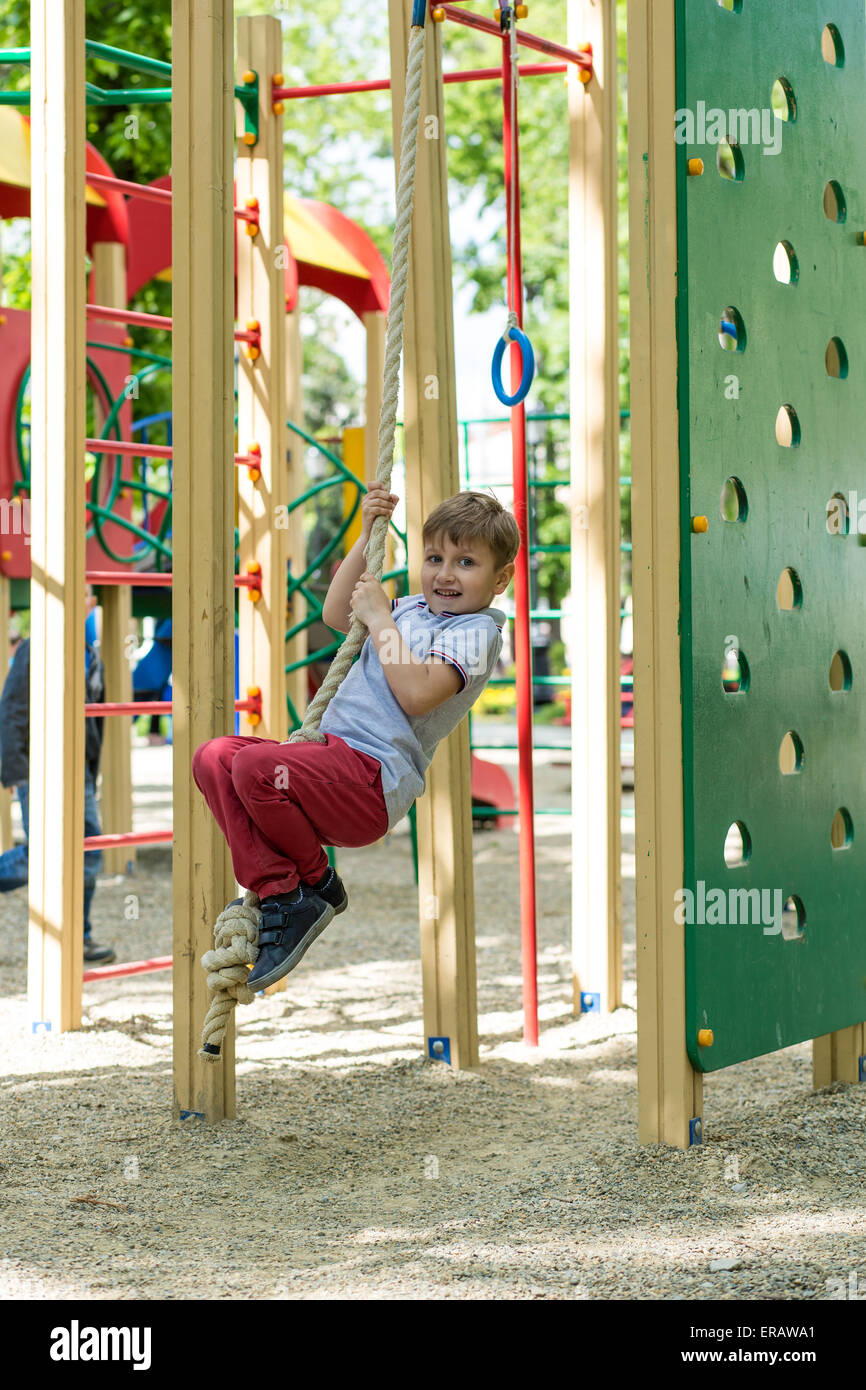 Little boy playing at playground on a sunny day Stock Photo - Alamy