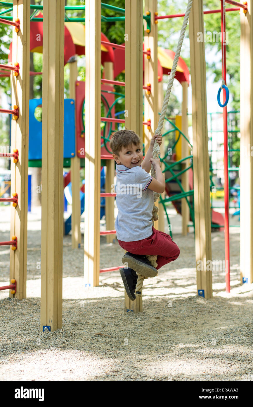 Little boy playing at playground on a sunny day Stock Photo - Alamy