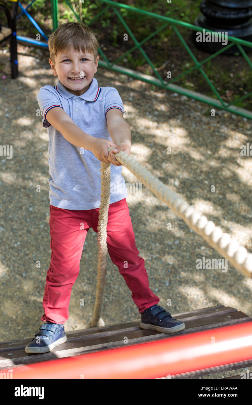 Little boy playing at playground on a sunny day Stock Photo - Alamy