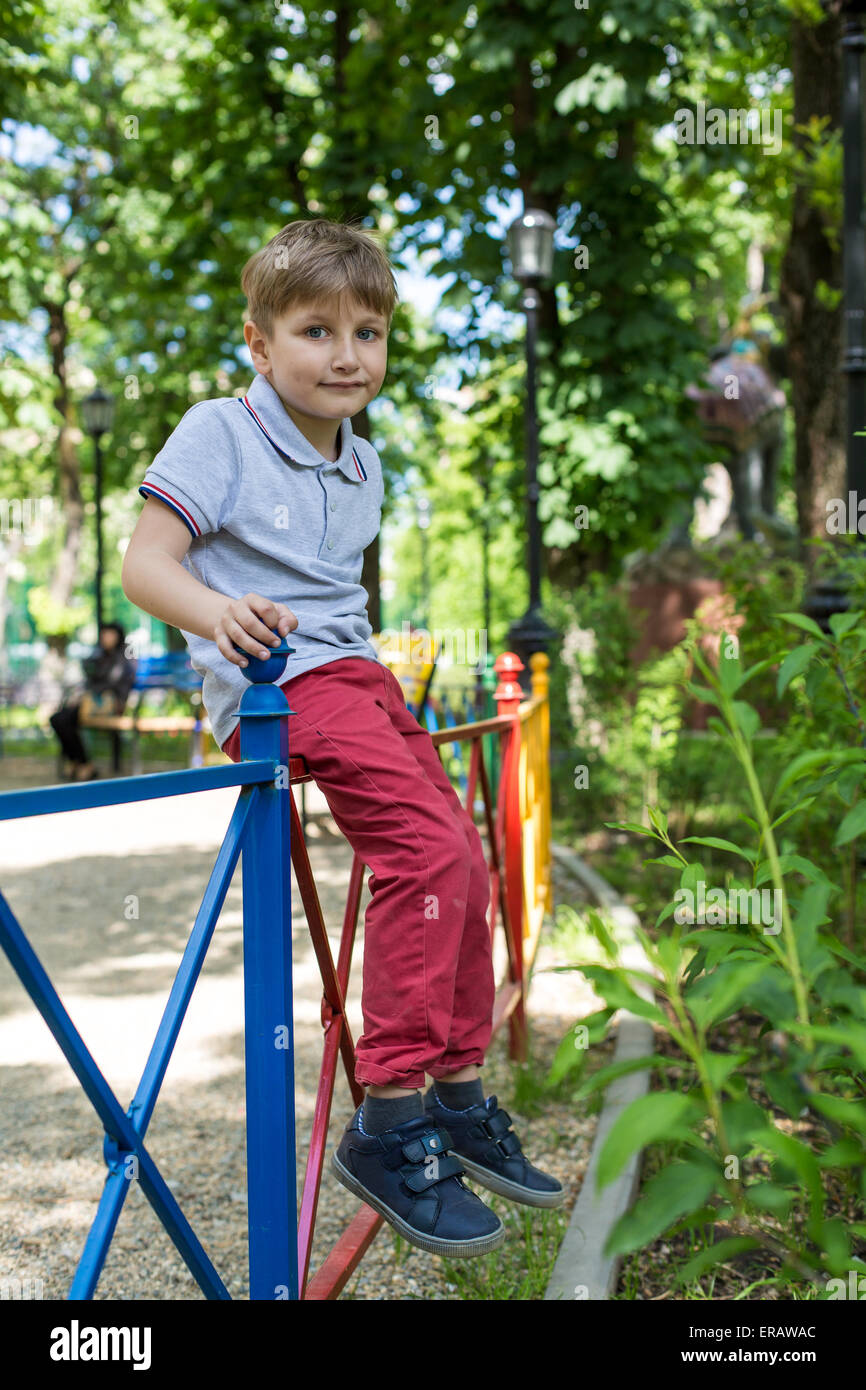 Little boy playing at playground on a sunny day Stock Photo - Alamy